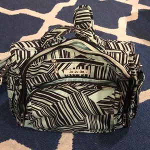 Jujube mint and black striped backpack.